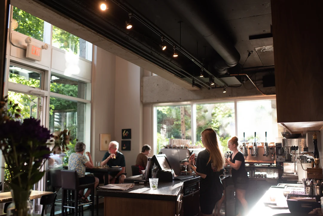 The sunlit counter and seating area at Tre Fantastico café