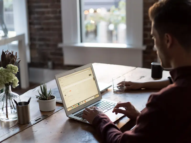 A business owner working on a laptop