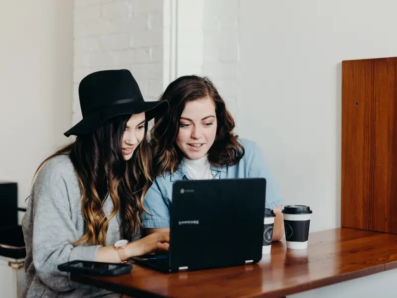 Two business owners working together at a laptop