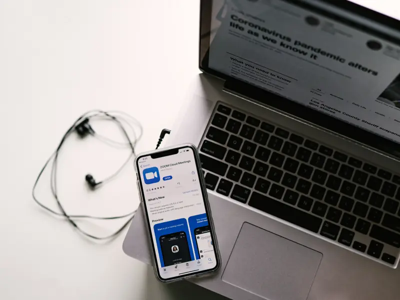 A phone and laptop on a business owner’s desk